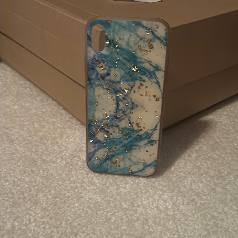 Claire's Blue and Gold Phone Case with Unique Marbled Design